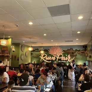 lively inside restaurant with mural