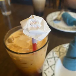 Thai Tea with a straw wrapper flower