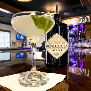 a martini and a bottle of gin