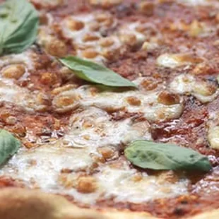 a pizza on a wooden board