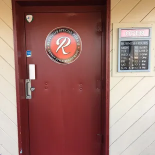 Front door with hours.