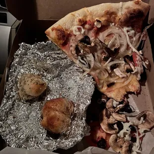 Veggie slice with cinnamon and garlic knots.