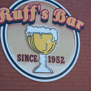 a beer glass on a sign