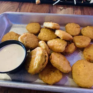 Amazing fried pickles but beware: the insides are piping hot and juicier than jello!