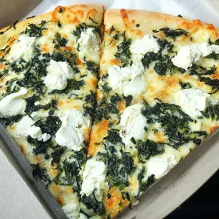 two slices of pizza in a box