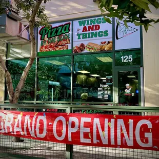 a sign in front of a restaurant