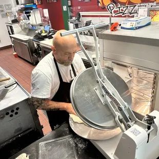 a man preparing food in a kitchen