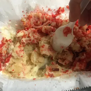 Excess cheese mixed into the potato, not just on top.
