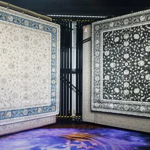 a blue and white rug in a corner of a room