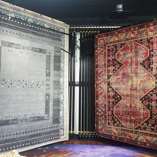 a view of a large area with a variety of rugs on display