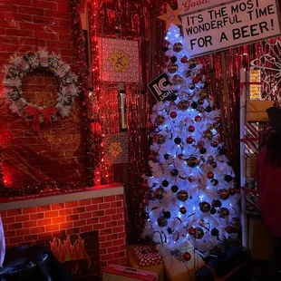 a decorated christmas tree and a sign