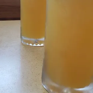 two glasses of beer on a table