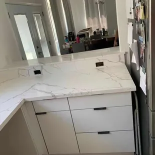 White river and acrylic white kitchen cabinets