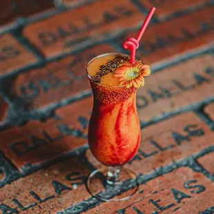 a bloody cocktail on a brick patio