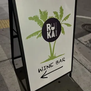 a sign for a wine bar