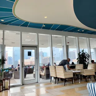 a restaurant with a view of the city