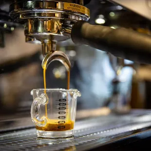 coffee being poured into a cup