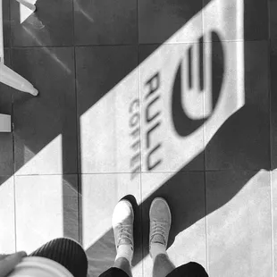 a person standing on a tiled floor