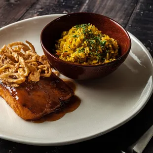 a plate of food on a wooden table