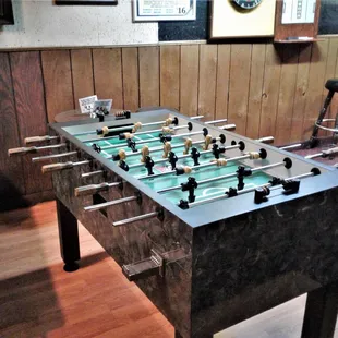 a foosball table in a bar