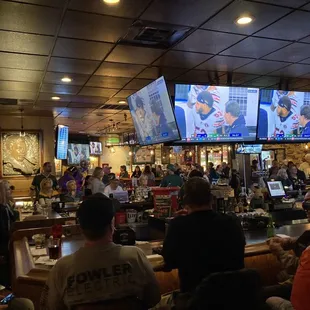 a large group of people watching tvs