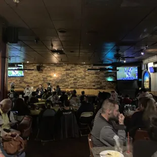 a crowd of people sitting at tables