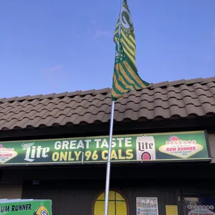 a man standing in front of the restaurant