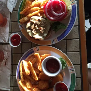 Mushroom &amp; swiss burger and breaded shrimp with fries