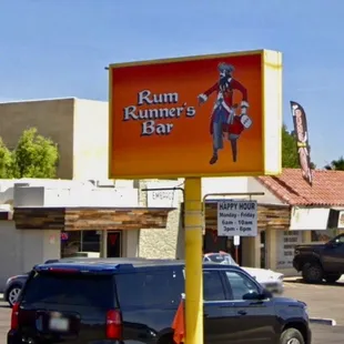 a sign for rum runner&apos;s bar