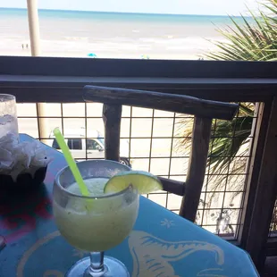 Frozen mojito and view of the beach