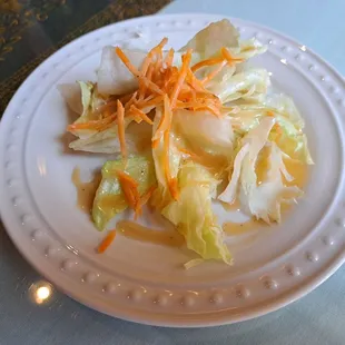 Complimentary salad with weekday lunch specials. Dressing is peanut based and sweet.