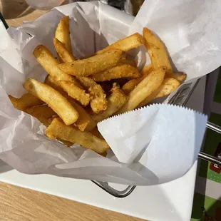 a basket of french fries on a table