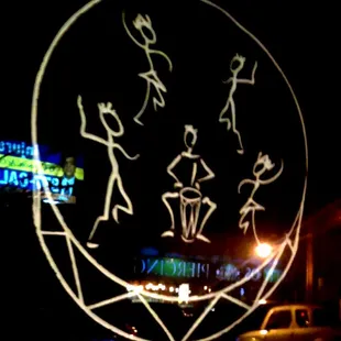 Window painting with the glow of Summit reflecting off. The primitive lines express well the counter-culture nature of the space.