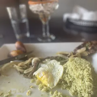 Churrasco with cilantro rice/maduros . I added the egg. Sorry that it is half eaten but I always forget to take the picture before hand :(