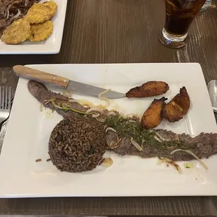 Churrasco - Grilled skirt steak with chimichurri sauce on the side. Served with 2 sides of your choice