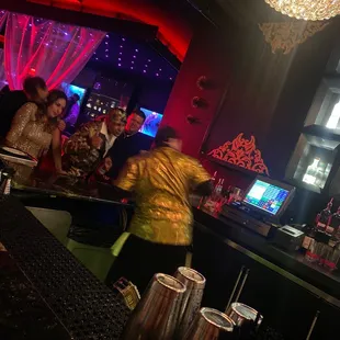 a group of people at a bar