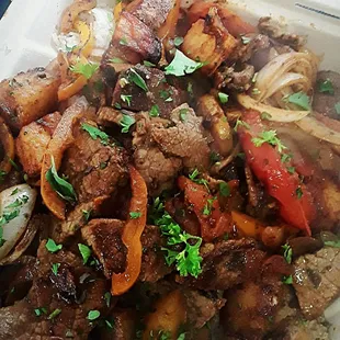 a plate of meat and vegetables