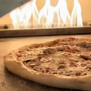 Custom pizza made in clay oven
