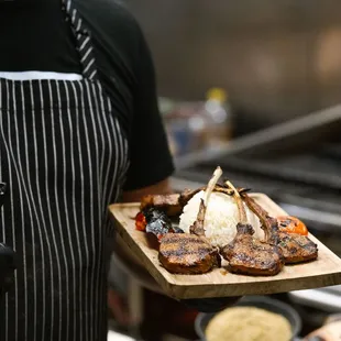 Succulent lamb chops, expertly seasoned and grilled for a tender, juicy bite. A must-try for those who love rich, savory flavors.