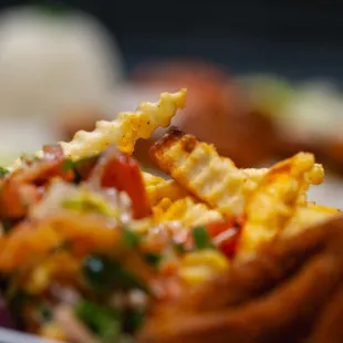 Crispy, lightly breaded baby calamari is fried until golden and served with our house-made sauce for a bright, flavorful finish.