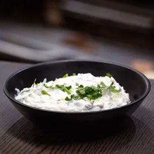 Smooth and tangy, this appetizer blends sour cream with fresh dill, mint, and a gentle touch of garlic. A drizzle of butter and olive oil.