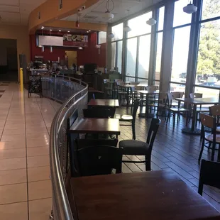 empty tables and chairs in a restaurant