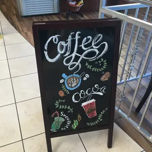 a chalkboard sign for coffee