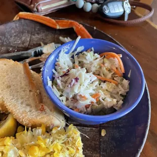 The cole slaw tasted old. It didn't taste fresh. The corn was not fresh. It was probably frozen not fresh. Who knows!