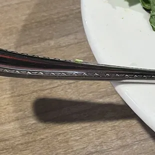 a fork and salad on a plate