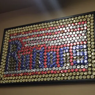 the american flag made out of beer caps