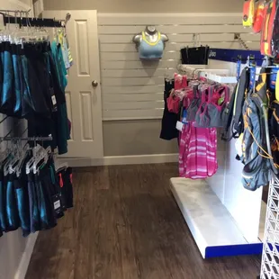 Women's tops, bottoms, and sports bra. There's even a fitting room!