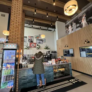 a woman standing at the counter