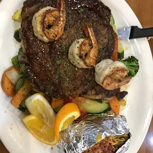 Ribeye steak, vegetables &amp; loaded baked potatoes.
