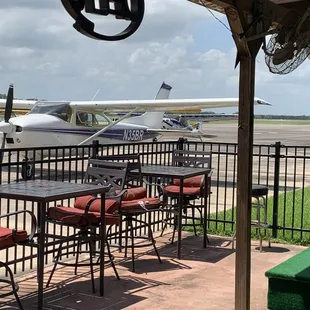 Plane parked right outside the cafe.